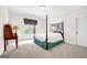 Bedroom featuring a four-poster bed, neutral carpet, and window with decorative valance at 2795 Hawthorne Dr, Atlanta, GA 30345
