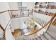 Foyer featuring a curved staircase, a large chandelier, hardwood floors, and a bookcase at 2795 Hawthorne Dr, Atlanta, GA 30345