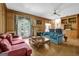 Cozy living room with wood paneling, a fireplace, built-in shelves, and comfortable seating for relaxation at 2795 Hawthorne Dr, Atlanta, GA 30345