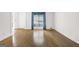 Bright living room with hardwood floors, white walls, and a large window dressed with elegant curtains at 2795 Hawthorne Dr, Atlanta, GA 30345