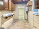Basement space with wooden cabinets, a counter, and a door leading to another room at 120 Rolling Brook Trl, Fayetteville, GA 30215