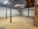 Unfinished basement space with exposed ceiling, support beams, and concrete floors at 120 Rolling Brook Trl, Fayetteville, GA 30215