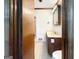 Bathroom featuring a dark wood vanity and white tile flooring at 120 Rolling Brook Trl, Fayetteville, GA 30215