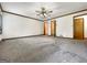 Bedroom featuring carpet flooring, a ceiling fan, and multiple closets at 120 Rolling Brook Trl, Fayetteville, GA 30215