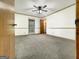 Bedroom with neutral carpet, a ceiling fan, and natural light from the window at 120 Rolling Brook Trl, Fayetteville, GA 30215