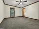 Bedroom with neutral carpet, a ceiling fan, and natural light from the window at 120 Rolling Brook Trl, Fayetteville, GA 30215