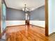 Elegant dining room boasts chair rail and crown molding detail with wood flooring at 120 Rolling Brook Trl, Fayetteville, GA 30215