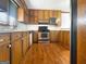 Kitchen featuring wood cabinets, stainless steel appliances, and hardwood floors at 120 Rolling Brook Trl, Fayetteville, GA 30215