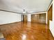 Spacious living room featuring hardwood floors, a ceiling fan, and built in shelving at 120 Rolling Brook Trl, Fayetteville, GA 30215