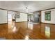 Bright living room featuring hardwood floors, fireplace, and abundant natural light at 120 Rolling Brook Trl, Fayetteville, GA 30215