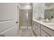 The bathroom features a glass walk-in shower, double vanity, and decorative elements at 82 Airmont Dr, Sharpsburg, GA 30277
