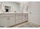 The bathroom features a double vanity, modern cabinetry, and a decorative rug at 82 Airmont Dr, Sharpsburg, GA 30277