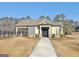 Charming clubhouse with a welcoming facade, complemented by a paved walkway and well-maintained community surroundings at 82 Airmont Dr, Sharpsburg, GA 30277