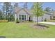 Beautiful single-Gathering home with well-maintained lawn and professional landscaping in a peaceful neighborhood at 82 Airmont Dr, Sharpsburg, GA 30277