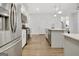 Charming kitchen with a stainless steel refrigerator and modern lighting at 82 Airmont Dr, Sharpsburg, GA 30277