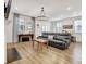 Cozy living room with a comfortable sofa, natural lighting, and wood floors at 82 Airmont Dr, Sharpsburg, GA 30277