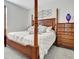 Spacious main bedroom with a four-poster bed, a dresser, and a neutral color scheme at 82 Airmont Dr, Sharpsburg, GA 30277