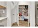 Walk-in pantry with stocked shelves and white doors at 82 Airmont Dr, Sharpsburg, GA 30277
