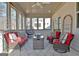 The back porch features a ceiling fan, stylish seating, decor, and lots of natural light at 82 Airmont Dr, Sharpsburg, GA 30277