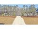 Community pool area featuring a fenced pool, lounge chairs, and landscaping, offering a relaxing outdoor space at 82 Airmont Dr, Sharpsburg, GA 30277