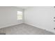 Cozy bedroom featuring neutral carpeting and trim, and bright natural lighting at 615 Cantrell Drive, Dallas, GA 30157
