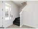 Welcoming entryway with modern vinyl floors, staircase, and a bright white front door at 615 Cantrell Drive, Dallas, GA 30157