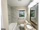 Bathroom features granite vanity and a shower-tub combo with tile surround at 2229 Sharon Way, Decatur, GA 30032