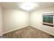 Bedroom with neutral walls, carpet flooring, and natural light from a window at 2229 Sharon Way, Decatur, GA 30032