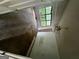 Bedroom featuring a ceiling fan and a window view, though in need of refurbishment at 1504 Colt Ridge Se Ln, Mableton, GA 30126