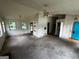 Spacious living area with a ceiling fan, a fireplace, and a blue door, waiting for updates at 1504 Colt Ridge Se Ln, Mableton, GA 30126
