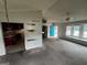 Open living room with a glimpse of the kitchen and a bright blue front door at 1504 Colt Ridge Se Ln, Mableton, GA 30126