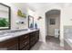 A dual vanity bathroom with granite countertops and decorative accents at 105 Turnberry Trce, Sharpsburg, GA 30277
