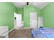 Neutral carpeted bedroom has a ceiling fan, access to the hall and lots of storage at 105 Turnberry Trce, Sharpsburg, GA 30277