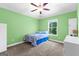 A bright, colorful bedroom with a window that lets in lots of natural light at 105 Turnberry Trce, Sharpsburg, GA 30277