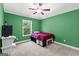 Bright bedroom with plush carpet, storage and soft light streaming through a window at 105 Turnberry Trce, Sharpsburg, GA 30277