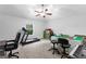 Spacious bedroom featuring a ceiling fan, exercise equipment, and a large table with chairs at 105 Turnberry Trce, Sharpsburg, GA 30277