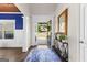 Inviting foyer showcasing hardwood floors and a view of the lush front yard at 105 Turnberry Trce, Sharpsburg, GA 30277