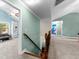 Upstairs hallway with an ornate bannister leading to a multi-purpose room at 105 Turnberry Trce, Sharpsburg, GA 30277
