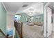 A second-story hallway leading to an upstairs living room with vaulted ceilings at 105 Turnberry Trce, Sharpsburg, GA 30277