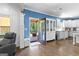 Bright kitchen area featuring white cabinetry, modern appliances, and a door leading to the back porch at 105 Turnberry Trce, Sharpsburg, GA 30277