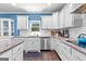 Bright kitchen with granite counters, stainless steel appliances, and white subway tile backsplash at 105 Turnberry Trce, Sharpsburg, GA 30277