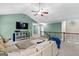 A spacious upstairs living room with a large sectional and loft railing at 105 Turnberry Trce, Sharpsburg, GA 30277