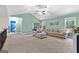 Upstairs living area with vaulted ceilings and neutral-colored walls at 105 Turnberry Trce, Sharpsburg, GA 30277