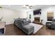 Comfortable living room featuring a stone fireplace and a large sectional sofa at 105 Turnberry Trce, Sharpsburg, GA 30277