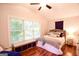 Bedroom with vaulted ceilings, large window and hardwood floors at 170 River Forest Dr, Fayetteville, GA 30214
