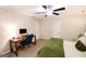 Comfortable bedroom with a wood desk and chair near the door and a full-sized bed at 170 River Forest Dr, Fayetteville, GA 30214