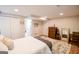 Comfortable bedroom features a large walk-in closet, stylish furnishings, and wood-look vinyl floors at 170 River Forest Dr, Fayetteville, GA 30214