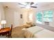 Serene bedroom with a full bed, a cozy chair, and a window with natural light at 170 River Forest Dr, Fayetteville, GA 30214
