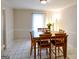Cozy dining room featuring hardwood table and chairs, with sheer curtains, perfect for Gathering gatherings at 170 River Forest Dr, Fayetteville, GA 30214
