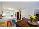 Open kitchen with white cabinetry, stainless appliances, eat-in table and island at 170 River Forest Dr, Fayetteville, GA 30214